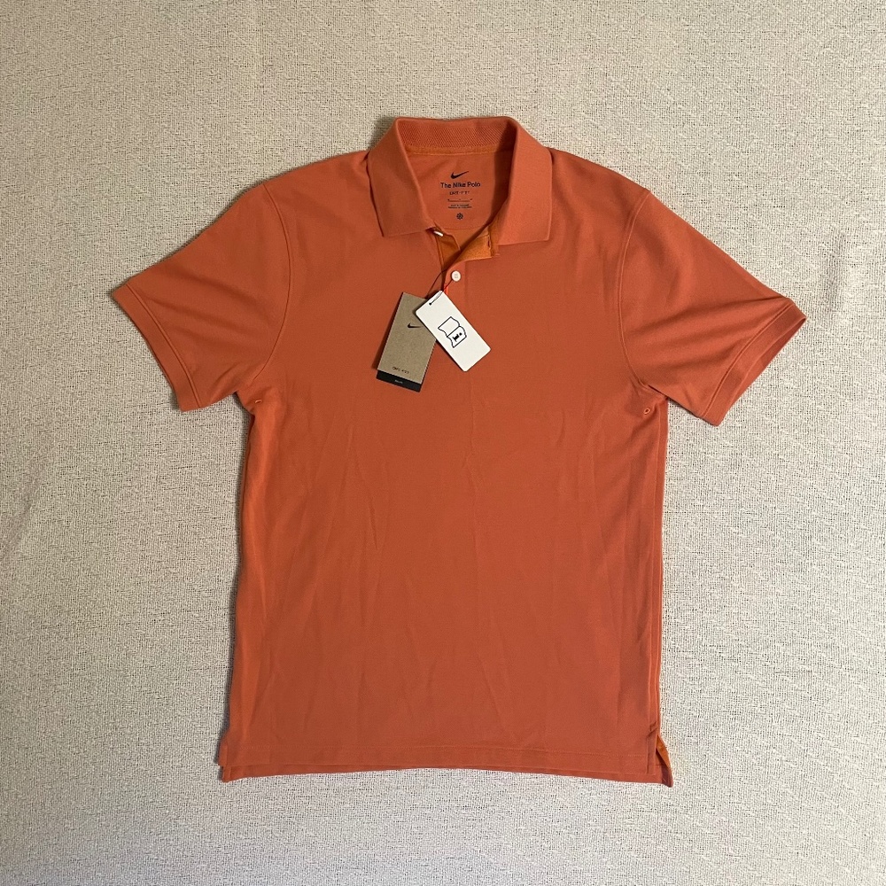 New with tags. The Nike Polo. Medium. Dri-Fit. Orange.
